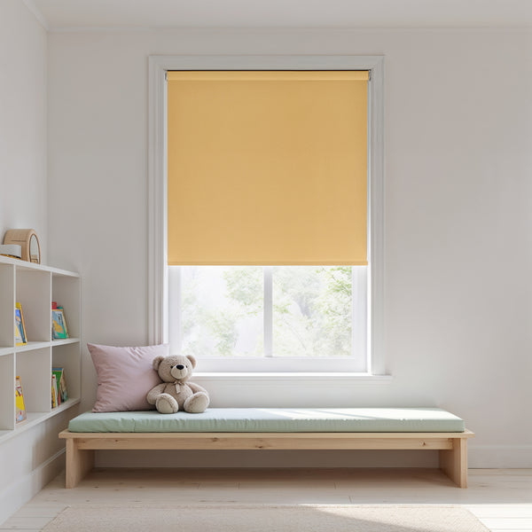Yellow roller blind on a window with a wooden bench and teddy bear in a room.
