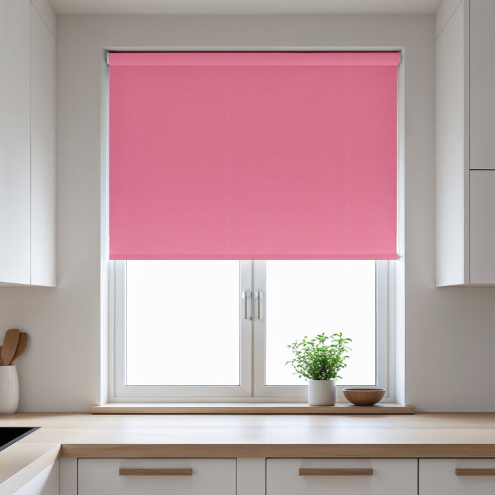 Pink roller blind on a window in a kitchen setting