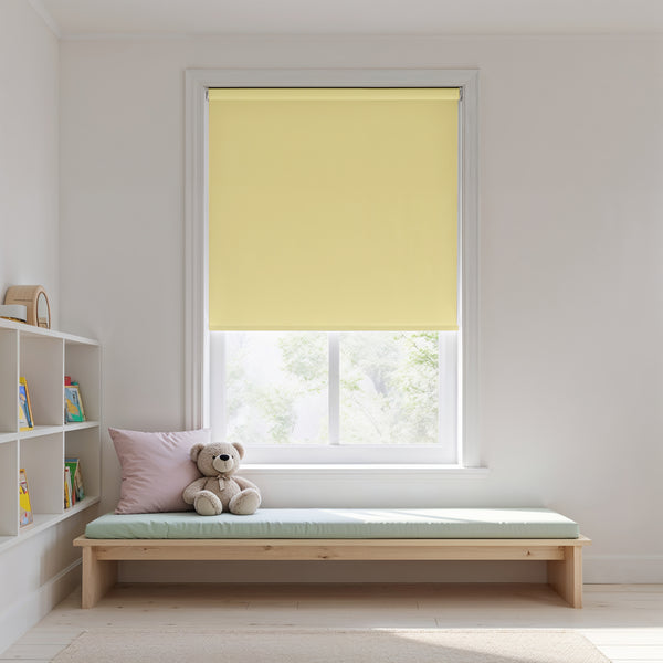 Yellow roller blind in a window with a wooden bench and teddy bear in a room.